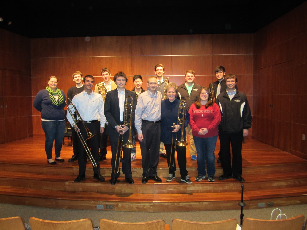 Ava Ordman with trombone studio students in a posed photo.